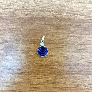 Silver and jeweled pendant